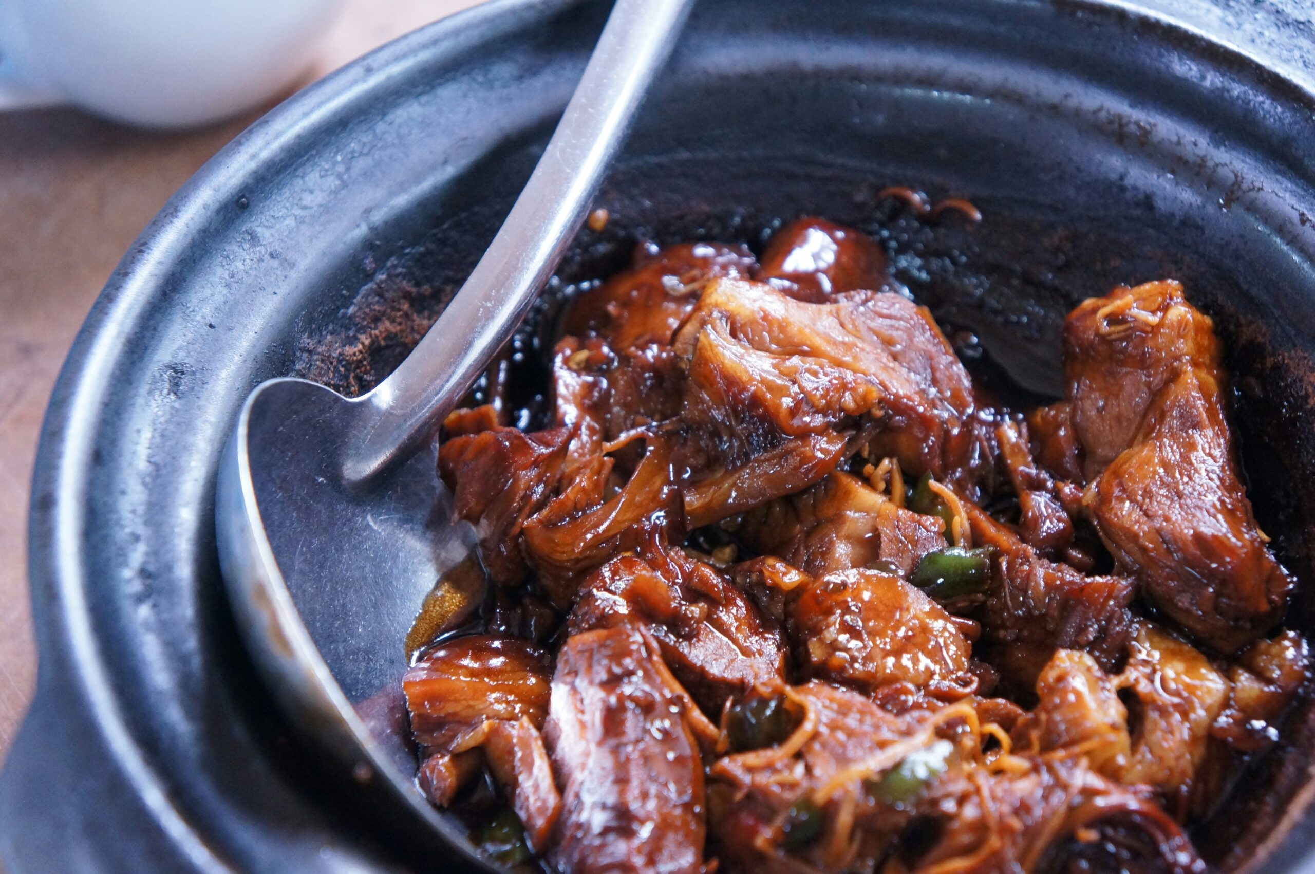 meat-with-sauce-in-black-bowl-scaled Home